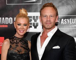 Actress Tara Reid (L) and actor Ian Ziering attend the premiere of 