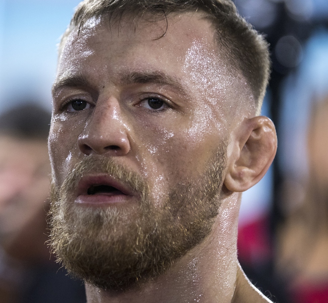 Conor McGregor conducts a media workout before a crowd within ...