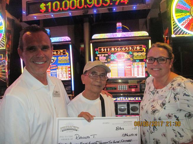 Las Vegas visitor Rodolfo T. hit a $11.8 million Nevada Megabucks jackpot on Aug. 8, 2017, at the Fremont Hotel and Casino. From left are Jim Sullivan, Fremont's vice president and general manager; Rodolfo T.; and Salinda Conklin, Fremont's slot director.