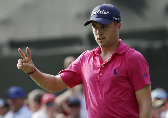 Justin Thomas celebrates after a birdie on the 13th hole during the final round of the PGA Championship golf tournament at the Quail Hollow Club Sunday, Aug. 13, 2017, in Charlotte, N.C. 