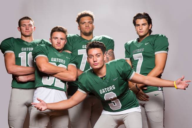 Members of the Green Valley High School football team, from left, Chas Kopp, Braxton Harms, Eric Brown, Christian Mayberry, and AJ Barilla pose for a portrait at the Las Vegas Sun's high school football media day August 2, 2017, at the South Point.