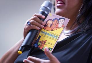 Edith Fernandez, associate vice president of community engagement and diversity initiatives at Nevada State College, holds a pamphlet on scholarships for Dreamers during a celebration of the fifth anniversary of DACA (deferred action for childhood arrivals) at the Mexican Consulate in downtown Las Vegas Tuesday, Aug. 15, 2017.