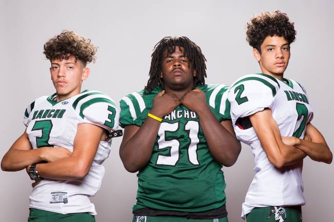 Members of the Rancho High School football team, from left, Mauricio Loya, Adrian Brown and Kendrick Nieves pose for a portrait at the Las Vegas Sun's high school football media day August 2, 2017, at the South Point.