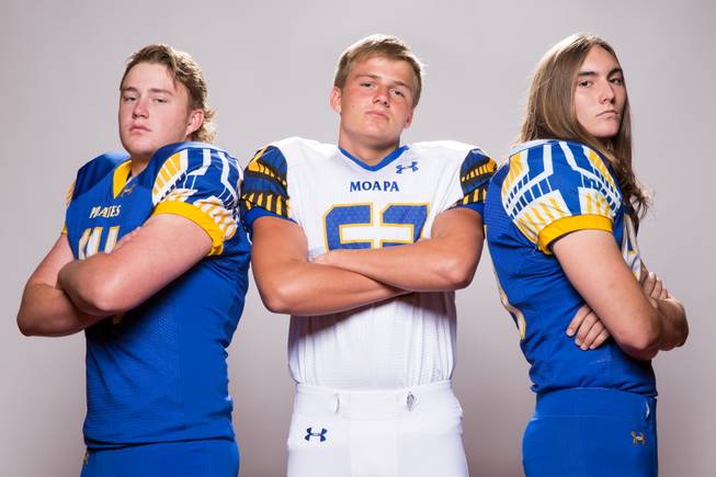 Members of the Moapa Valley High School football team, from left, Daxton Longman, Tyler Holmes and Logan Jaskson pose for a portrait at the Las Vegas Sun's high school football media day August 2, 2017, at the South Point.