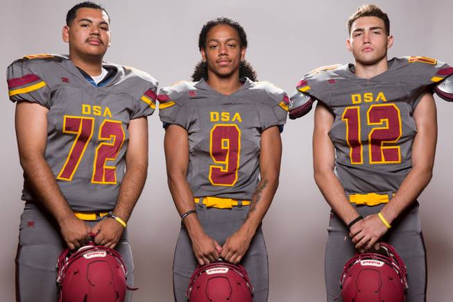 Members of the Del Sol High School football team, from left, Victor Cota, Barry Williams and Jason Hoyer pose for a portrait at the Las Vegas Sun's high school football media day August 2, 2017, at the South Point.