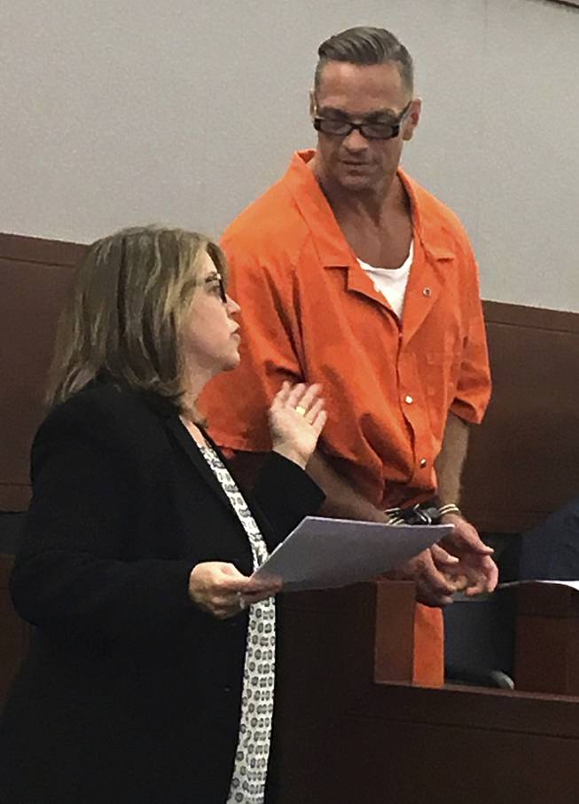 Nevada death row inmate Scott Raymond Dozier confers with Lori Teicher, a federal public defender involved in his case, during a Thursday, Aug. 17, 2017, appearance in Clark County District Court in Las Vegas.