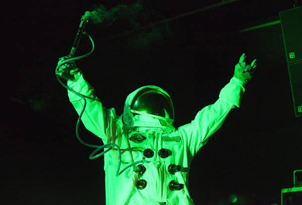 An astonaut mascot for Sleep smokes from a bong during their set at the Psycho Festival at the Hard Rock Hotel and Casino Friday, Aug. 18, 2017.