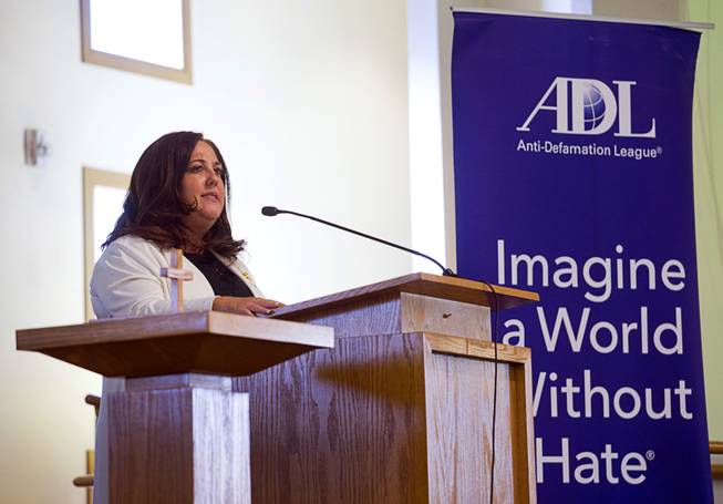 Jolie Brislin, regional director of the Anti-Defamation League, speaks during an interfaith Peace and Unity Vigil at the First AME Church in North Las Vegas Sunday, Aug. 20, 2017. The Anti-Defamation League and First AME Church sponsored the event.