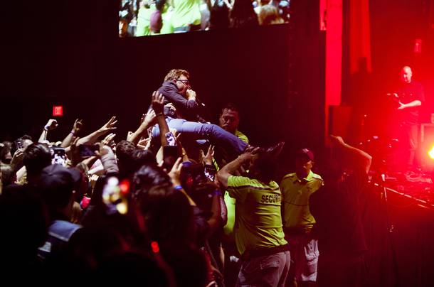 The Murder City Devils frontman Spencer Moody is helped down after crowd surfing during their set at the Psycho Festival at the Hard Rock Hotel and Casino, Sunday, Aug 20, 2017.