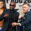 Floyd Mayweather Jr. and UFC lightweight champion Conor McGregor of Ireland pose during a news conference at the MGM Grand Wednesday, Aug. 23, 2017.
