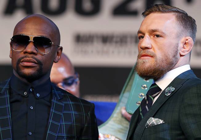 Floyd Mayweather Jr. and UFC lightweight champion Conor McGregor of Ireland pose during a news conference at the MGM Grand Wednesday, Aug. 23, 2017.