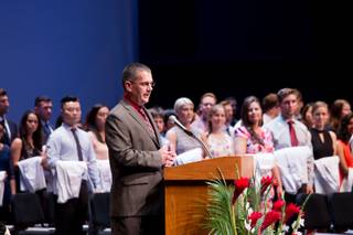Shawn Gerstenberger, Ph.D., Acting Dean, UNLV School of Medicine, speaks to students, family and friends during the school's charter class White Coat Ceremony at Artemus Ham Mall, Friday Aug. 25, 2017.