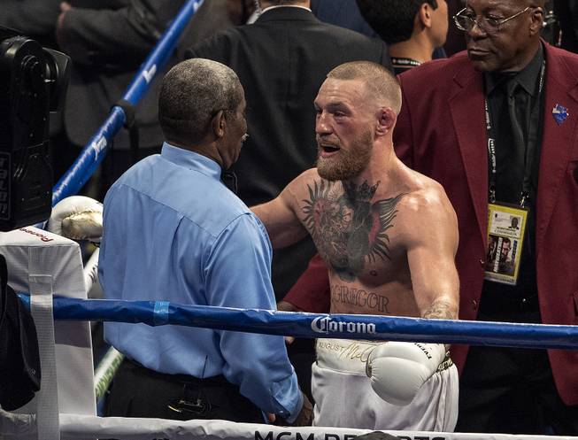 Super welterweight Conor McGregor questions the referee for stopping his fight he feels a bit soon versus Floyd Mayweather Jr. at the T-Mobile Arena on Saturday, August 26, 2017.