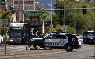 Snipers keep up position as Metro Police and SWAT officers are on the scene of shots fired on an RTC bus near N. Nellis Blvd. and E. Bonanza Road on Wednesday, August 30, 2017.