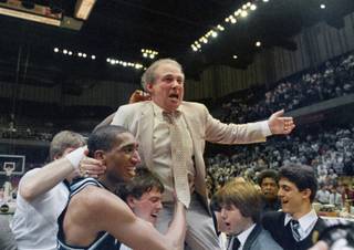 In this March 24, 1985, file photo, Villanova coach Rollie Massimino takes a victory ride on his players' shoulders. Massimino, who led Villanova's storied run to the 1985 NCAA championship and won more than 800 games in his career, died Wednesday, Aug. 30, 2017, after a long battle with cancer. He was 82. (AP Photo/File)