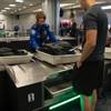 Travelers use new automated screening lanes at the security checkpoint in Terminal 3 at McCarran International Airport in Las Vegas, Nev. on August 31, 2017.