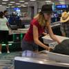 Travelers use new automated screening lanes at the security checkpoint in Terminal 3 at McCarran International Airport in Las Vegas on Aug. 31, 2017.