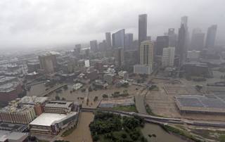 Highways around downtown Houston are empty as floodwaters from Tropical Storm Harvey overflow from the bayous around the city Tuesday, Aug. 29, 2017, in Houston. (AP Photo/David J. Phillip)