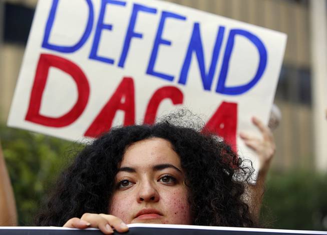 Loyola Marymount University student and dreamer Maria Carolina Gomez joins a rally in support of the Deferred Action for Childhood Arrivals, or DACA program outside the Edward Roybal Federal Building in Los Angeles Friday, Sept. 1, 2017. President Donald Trump says he'll be announcing a decision on the fate of hundreds of thousands of young immigrants who were brought into the country illegally as children in the coming days, immigrants he's calling "terrific" and says he loves. 