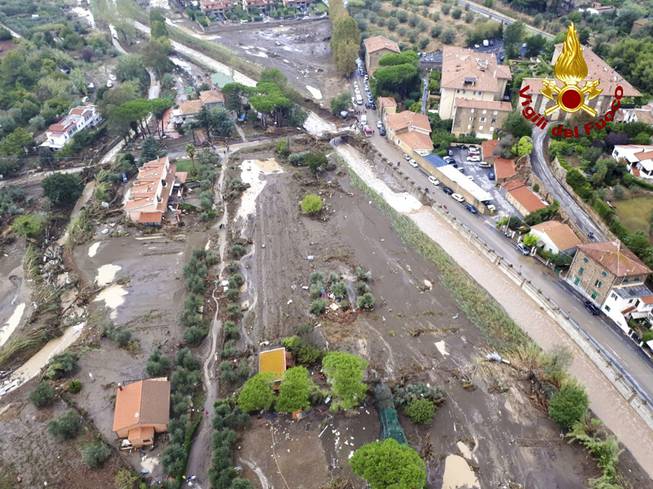 An aerial view of the city of Leghorn, Italy, following floods, Sunday, Sept. 10, 2017. Torrential rain in Italy has triggered flooding that killed at least five people in Tuscany. Italian state television said four of the victims were family members whose bodies were found in a flooded basement the Tuscan port town of Leghorn, also known as Livorno. Authorities said two people in the Leghorn area were missing.
