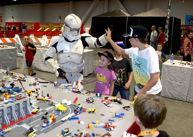 A Galactic Empire Stormtrooper helps put together rockets, space ships ...