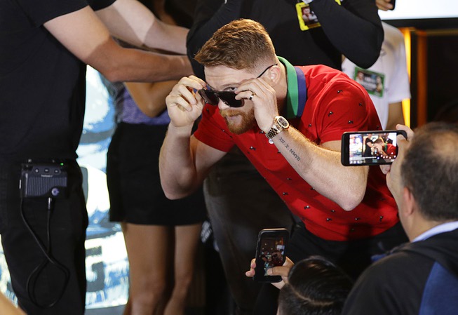 Canelo Alvarez walks on stage on stage during an event ...