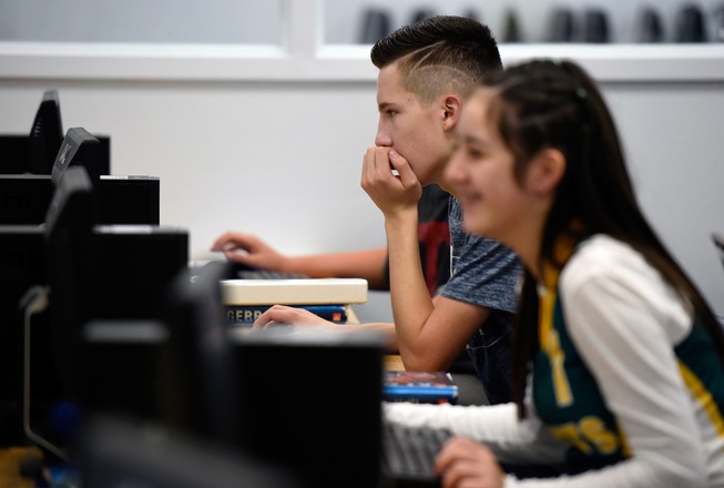 Students use a computer during their algebra class at Beatty High School on Friday, Sept. 15, 2017, in Beatty. Gov. Brian Sandoval and Valley Communications Association celebrated the connection of the company's high-speed fiber to the Beatty, Nev. school and the beginning of construction for the first all-fiber community in Nevada.