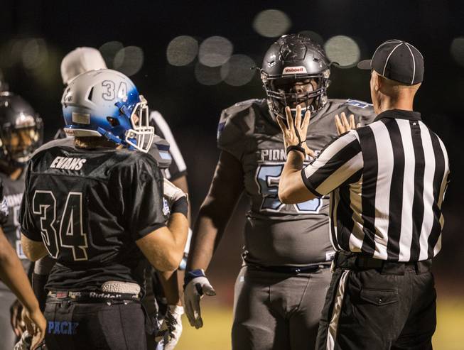 Canyon Springs' Germaine Carmena (50) is warned by a referee ...