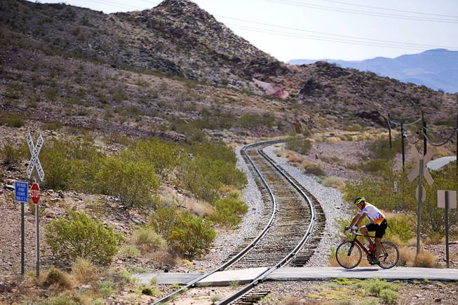 A cyclist crosses railroad tracks behind the Railroad Pass hotel-casino Sunday, Sept. 17, 2017.