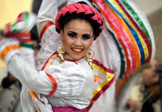Lupita Wence with the Mexico Vivo Dance Company performs during the official El Grito ceremony to kick off the the Mexican Independence Day festivities at The Forum Shops at Caesars Friday, Sept. 15, 2017, in Las Vegas.