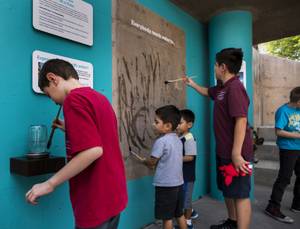 Kids water paint at WaterWorks, Springs Preserve's new permanent exhibit highlighting the inner workings of the valley's water treatment and delivery system, Friday, Sept. 15, 2017.