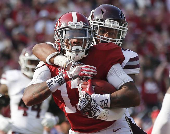 Alabama wide receiver ArDarius Stewart runs into the end zone and scores a touchdown against Mississippi State defensive back Mark McLaurin, during the second half of an NCAA college football game, Saturday, Nov. 12, 2016, in Tuscaloosa, Ala. Alabama won 51-3. 