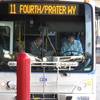 In this March 2, 2016, file photo, a passenger boards a city bus while the driver looks on at the bus station in downtown Reno.