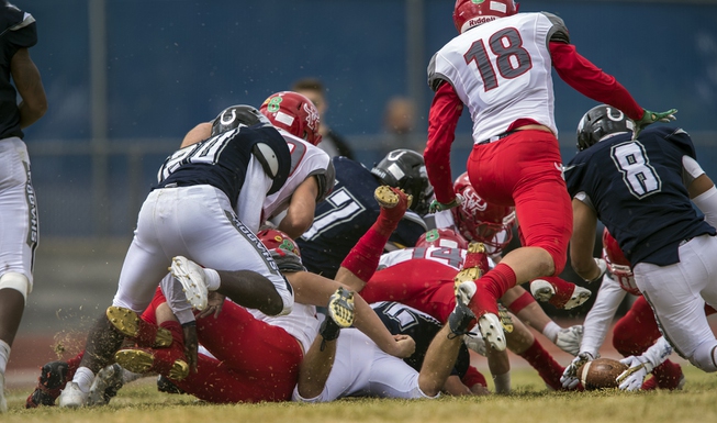Shadow Ridge and Arbor View players scramble about the field ...