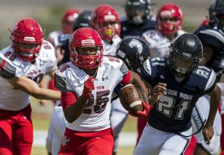 Arbor View's Kyle Graham (25) heads for open territory with Shadow Ridge's Kaejin Smith-Bejgrowicz (21) pursuing during their football game on Saturday, September 23, 2017.