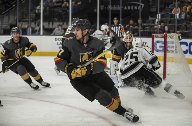 Vegas Golden Knights left defenseman Shea Theodore (27) cuts back to the puck versus the Los Angeles Kings during their preseason game at the T-Mobile Arena on Tuesday, September 26, 2017.   .