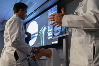 Resident MD Tyler Kent demonstrates how to use the VirtaMed Arthros - a new training device for arthroscopic surgery at UNLV School of Medicine in Las Vegas, Nev. on September 27, 2017.
