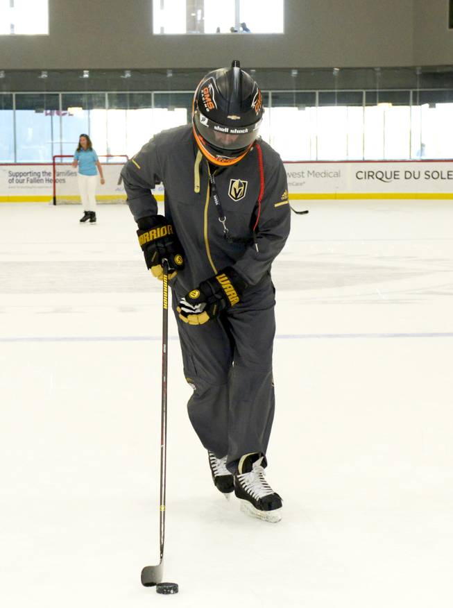 Murray Craven, hockey professional takes a turn around the ice in the winning helmet presented to the Las Vegas Golden Knights by NASCAR Camping World Truck Series Champion Johnny Sauter during a hockey skills clinic for the NCWTS drivers led by retired hockey professional and Golden Knights TV Analyst Shane Hnidy at City National Arena in Las Vegas. Friday, September 29, 2017.