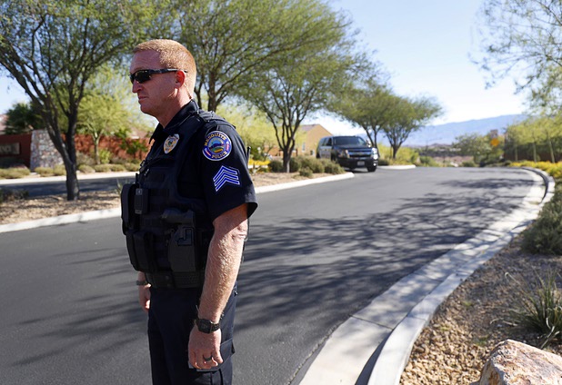 Mesquite Police Sgt. Tracy Fails stands at the entrance to the Prominence community, where mass shooter Stephen Craig Paddock owned a home, in Mesquite, Nev. Monday, Oct. 2, 2017.
