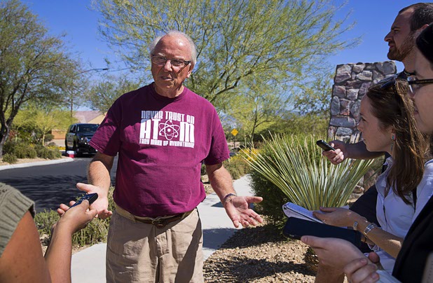 Resident Tom Jennings speaks to reporters at the entrance to the Prominance community, where mass shooter Stephen Craig Paddock owned a home, in Mesquite, Nev. Monday, Oct. 2, 2017.