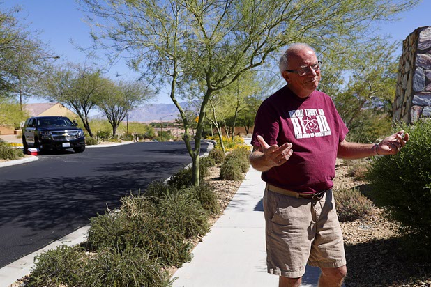 Resident Tom Jennings speaks to reporters at the entrance to the Prominance community, where mass shooter Stephen Craig Paddock owned a home, in Mesquite, Nev. Monday, Oct. 2, 2017.