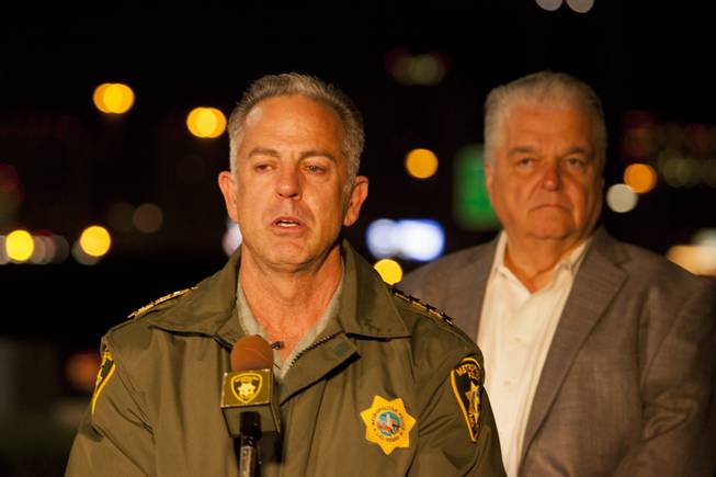 Clark County Sheriff Joe Lombardo briefs reporters outside Metro Police headquarters early Monday morning after a mass shooting at a music festival on the Las Vegas Strip Sunday, Oct. 1, 2017. Clark County Commission Chairman Steve Sisolak stands behind Lombardo at right.