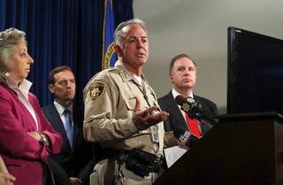Clark County Sheriff Joe Lombardo, center, responds to a question during a media briefing at the Las Vegas Metro Police headquarters in Las Vegas Tuesday, Oct. 3, 2017.