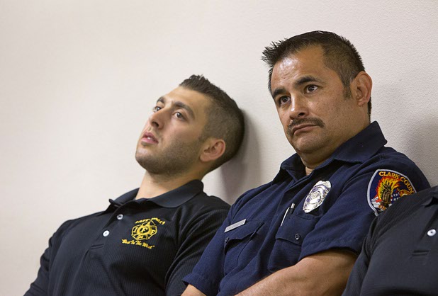 Henderson firefighter Anthony Robone, left, and Clark County firefighter Jesse Gomez listen during a news conference at the International Association of Firefighters Union Hall, Local 1285, Tuesday, Oct. 3, 2017. Robone and Gomez who were off-duty and attending the Route 91 Harvest festival seperately with family members on Sunday when gunman Stephen Paddock opened fire on the crowd.