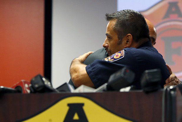 Clark County Firefighter Jesse Gomez, right, gets a hug from Angelo Aragon, president of the Professional Fire Fighters of Nevada, after speaking at the International Association of Firefighters Union Hall, Local 1285, Tuesday, Oct. 3, 2017. Gomez was among many off-duty firefighters attending the Route 91 Harvest festival on Sunday when gunman Stephen Paddock opened fire on the crowd.