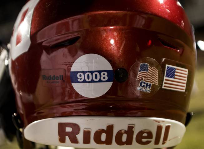New stickers on the Coronado and Basic player's helmets as a tribute to Charleston Hartfield, the off-duty cop who died during Sundays shooting. His son, Ayzayah Hartfield, plays for Coronado on Friday, October 6, 2017.   .