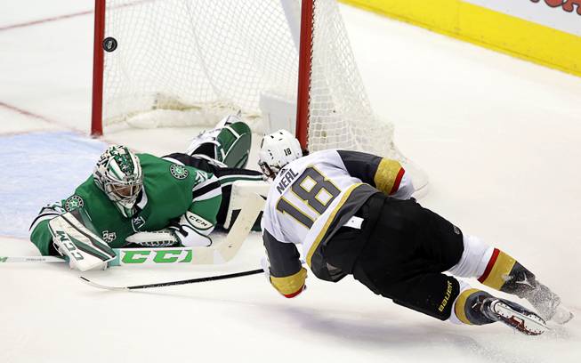 Vegas Golden Knights left wing James Neal (18) scores a goal against Dallas Stars goalie Kari Lehtonen (32) during the third period of an NHL hockey game in Dallas, Friday, Oct. 6, 2017. 