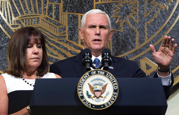 Vice President Mike Pence is joined by his wife Karen as he speaks in Las Vegas City Hall following a Unity Prayer Walk Saturday, Oct. 7, 2017. 