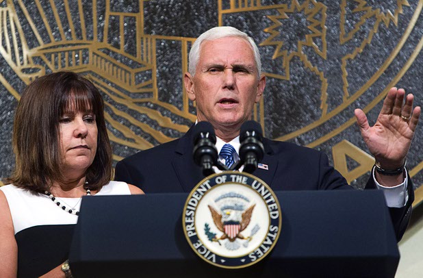 U.S. Vice President Mike Pence is joined by his wife Karen as he speaks in Las Vegas City Hall following a Unity Prayer Walk Saturday, Oct. 7, 2017.