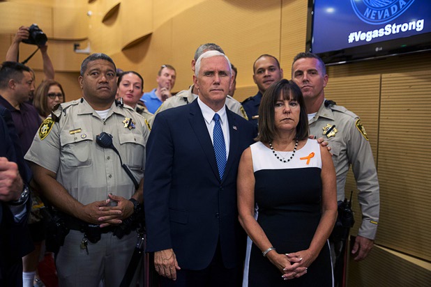 U.S. Vice President Mike Pence is joined by his wife Karen pose with Metro Police officers in Las Vegas City Hall following a Unity Prayer Walk Saturday, Oct. 7, 2017.